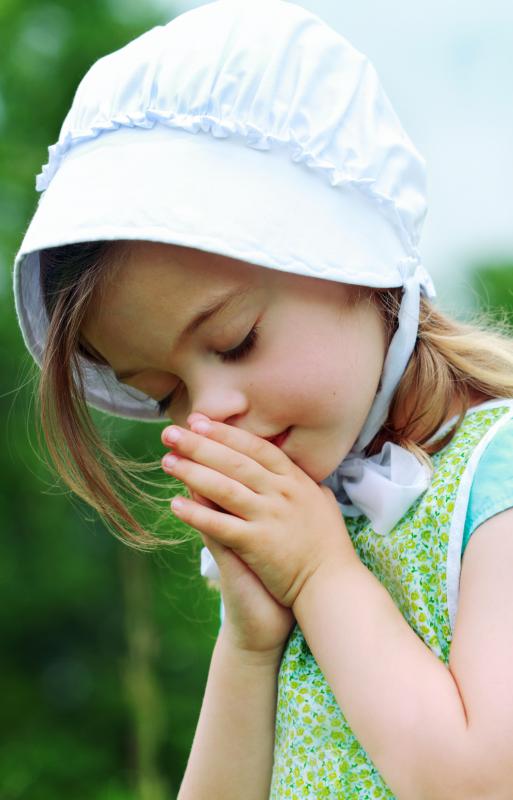 A Mennonite girl praying.