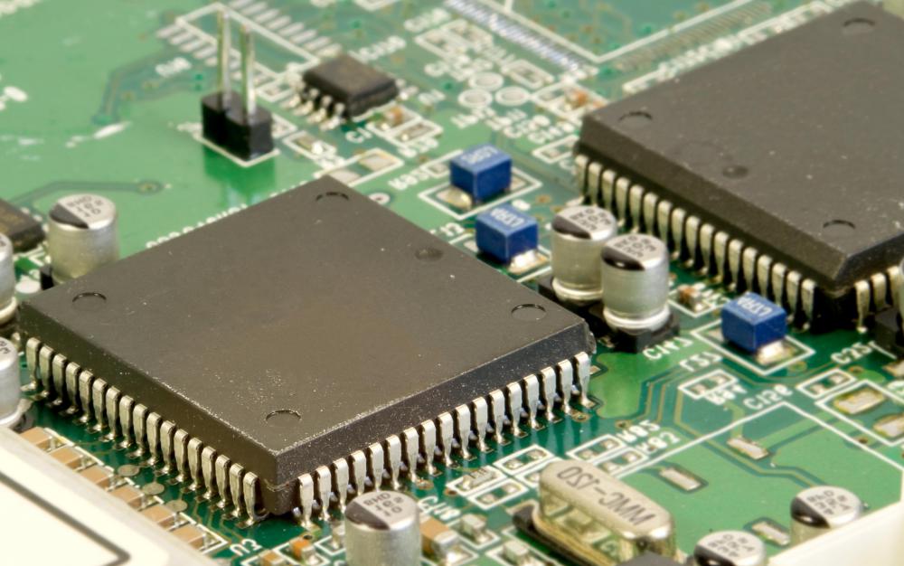 Two microcontrollers embedded into a printed circuit board (PCB).