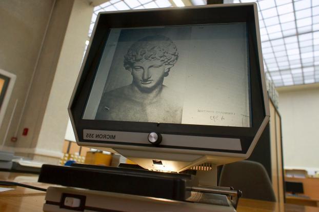 A microfiche reader can zoom, rotate, or focus on a particular image.