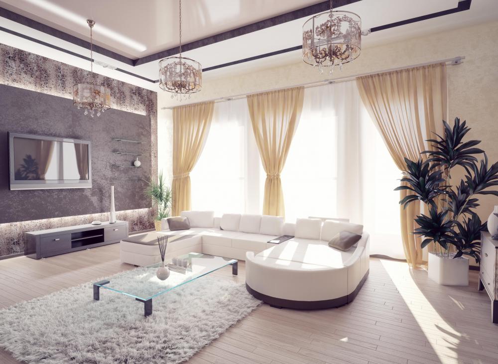 Peope who favor minimalist yet elegant living room designs may want to paint the walls and buy furniture in various shades of gray.