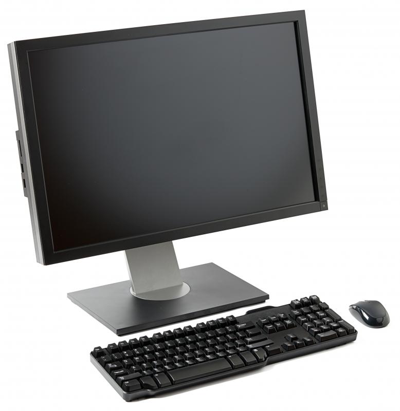 A computer, keyboard, and mouse at an ergonomic workstation.