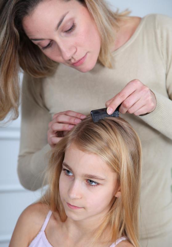 Pediculosis caused by head lice may be treated by combing nits out of the hair of an infected person.