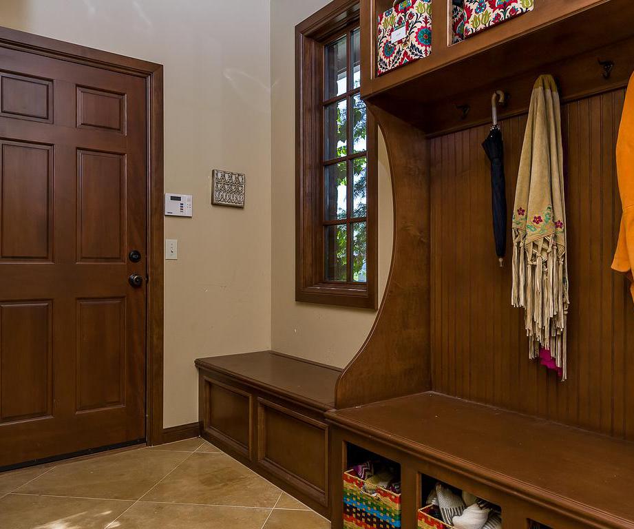 Mud room with bench for sitting.