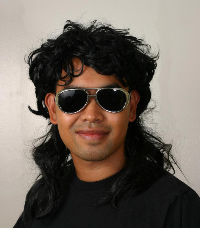 The hair in a mullet is long in the back and short in the front, on the top and on the sides.