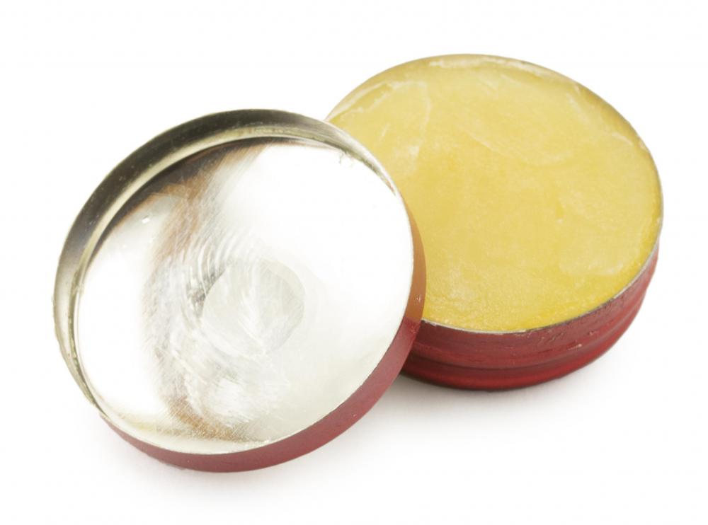 Salve, which typically comes in a tin container and contains waxes and oils, can be used to treat dry and chap lips and skin.