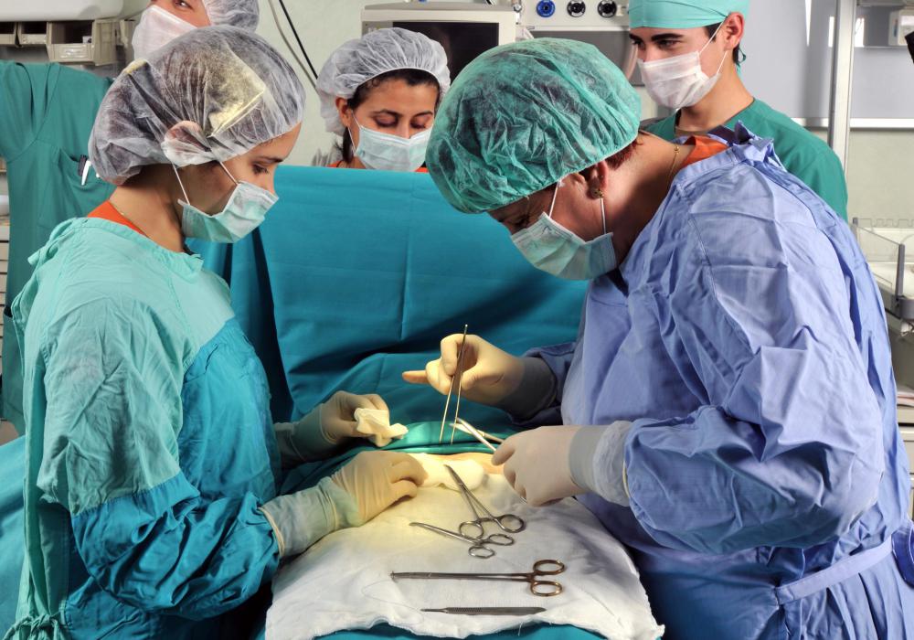 An obstetric anesthesiologist responds to input from the surgical team to determine the necessary level of anesthesia.