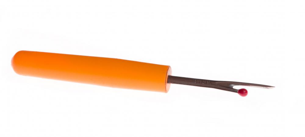 A seam ripper may be used to make holes in the knees of distressed jeans.