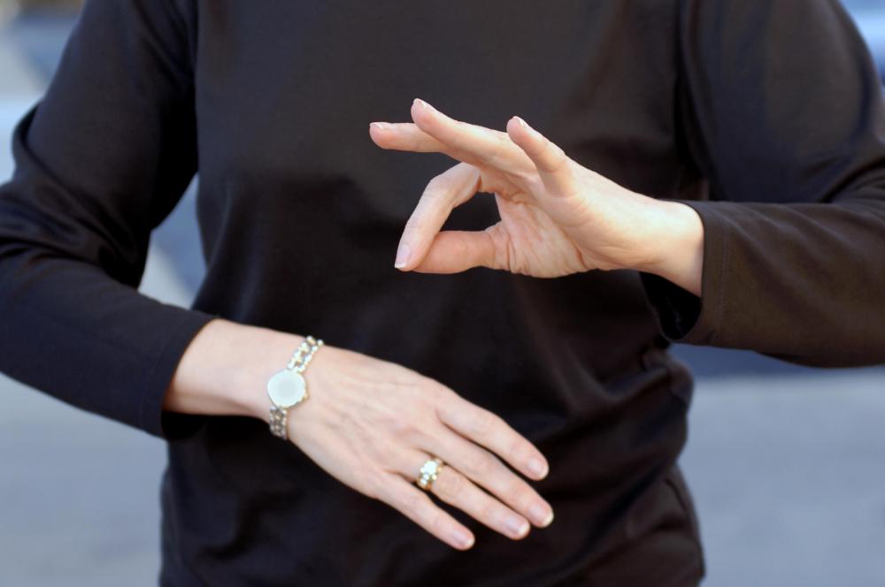 Many deaf people use sign language to communicate.