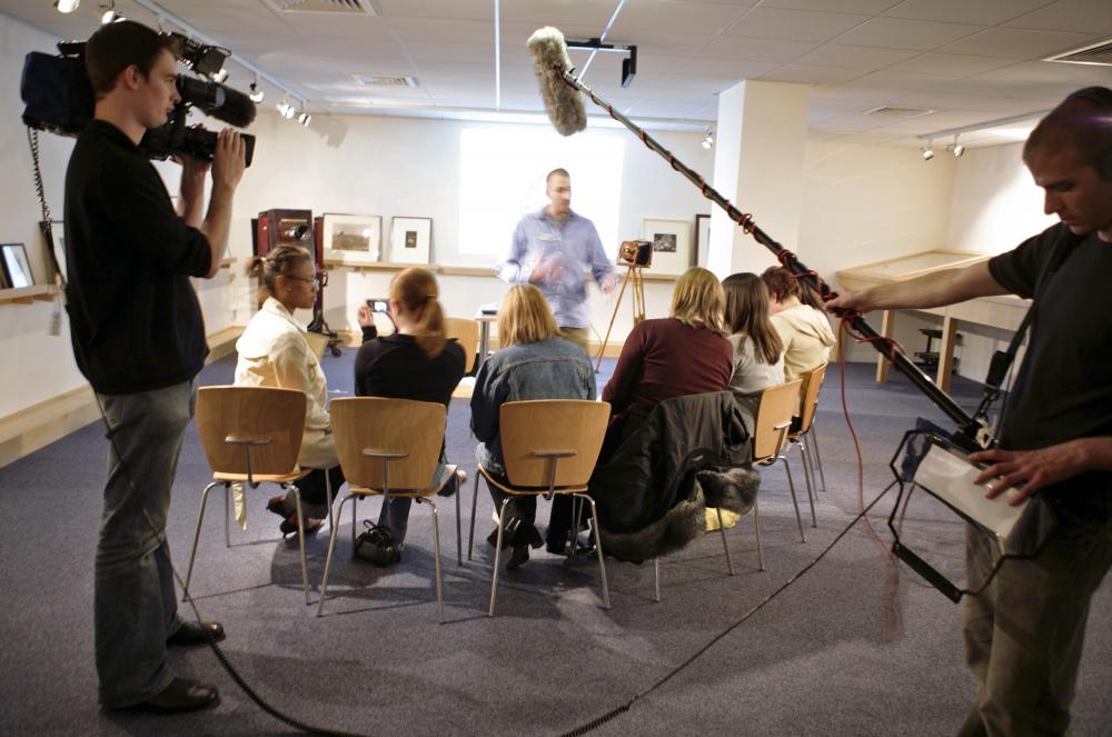 Boom mics may be used to amplify a group conversation.
