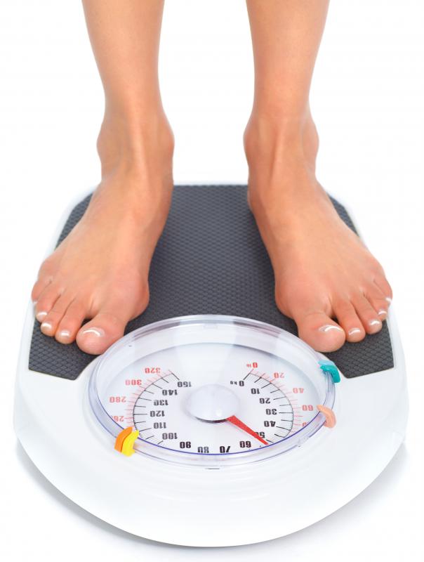 An individual is typically weighed on land before being weighed under water.
