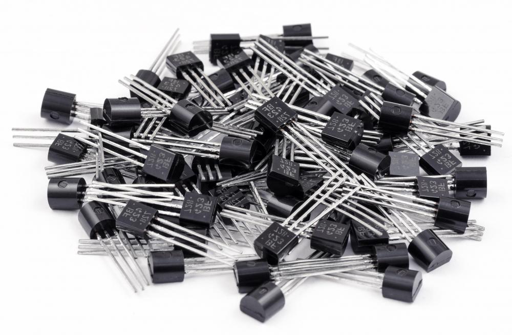 Transistors are typically identified by a printed code, often with one or two letters followed by a series of numbers, such as AC128.