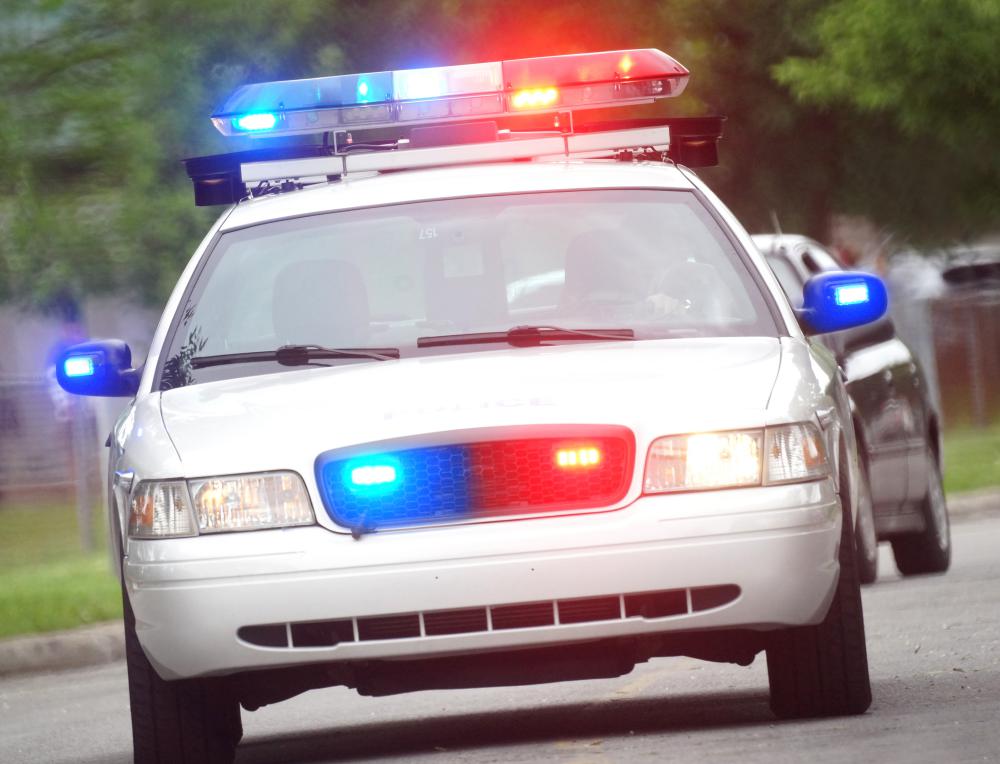 In a PIT maneuver, a police car forces a car to spin out or stop.