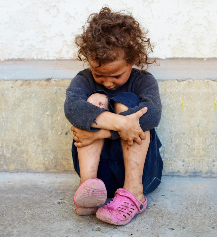 Body language communicates the girl's dejection.