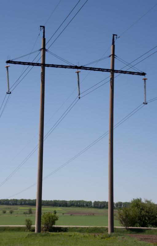 Triplex wire runs between outdoor power poles.