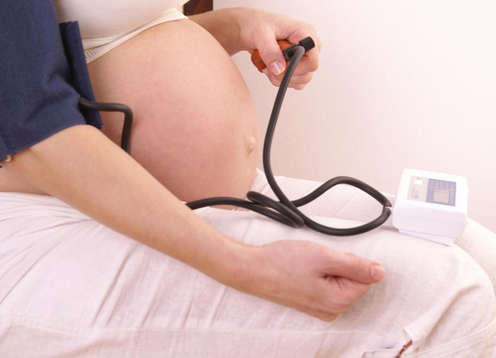 Hypotension in an unborn baby's mother may result in reduced fetal heart rate.