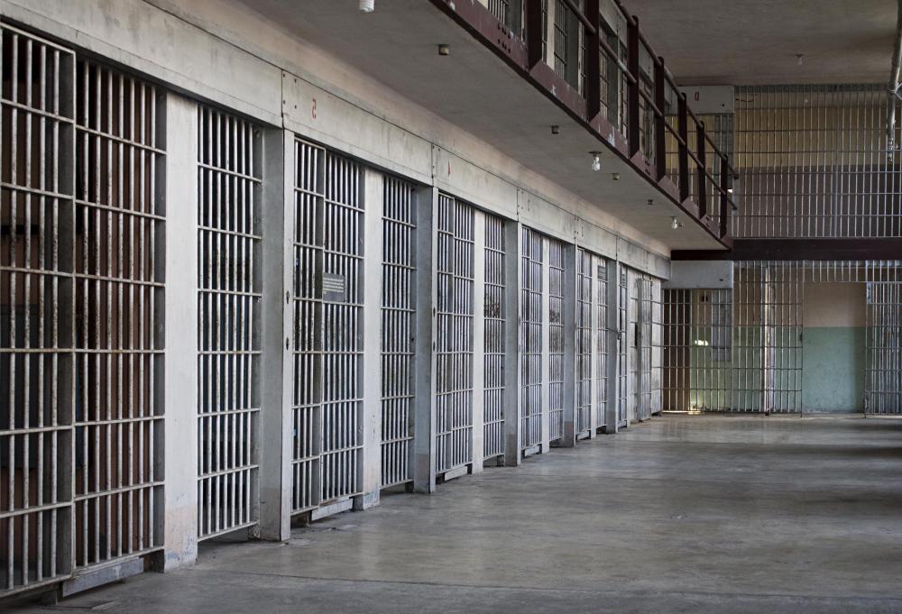 Prison cells are typically constructed of cement walls and steel bars.
