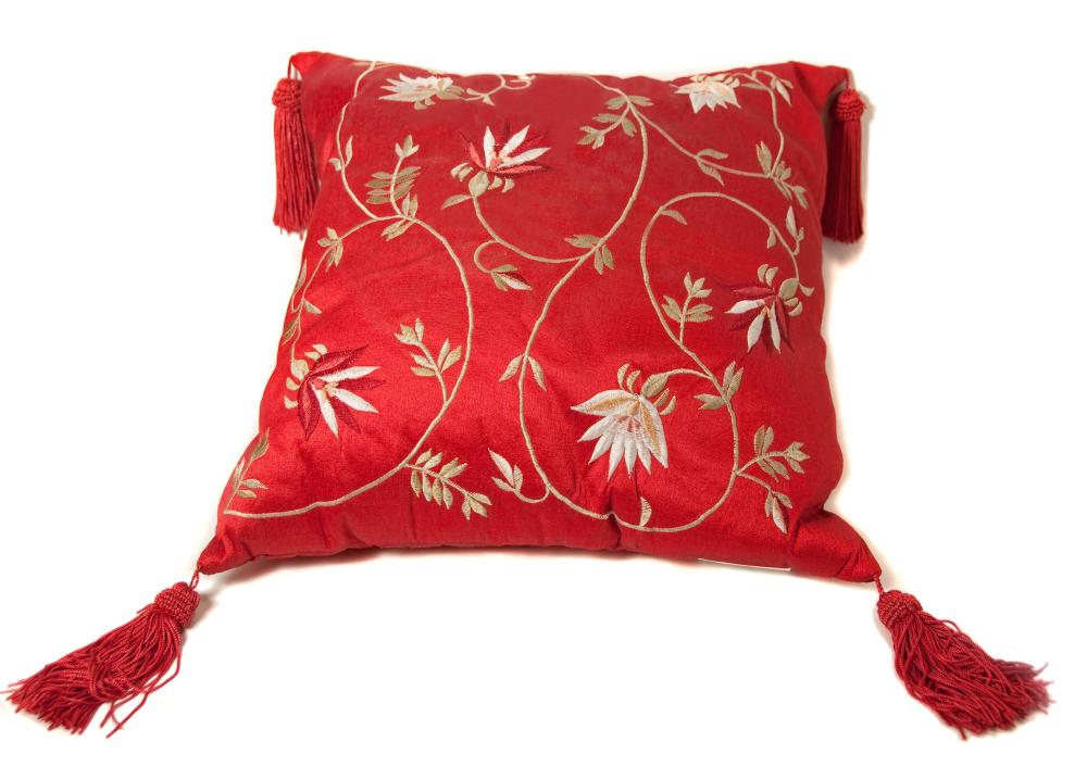 An embroidered satin pillow.