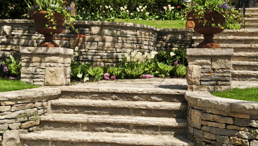 A retaining wall can be built with a series of steps or tiers to make it look more attractive.
