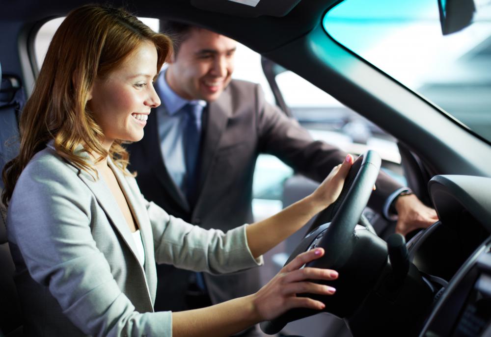 A car salesman will likely give a prospective customer a one-sheet for the model she is test driving.
