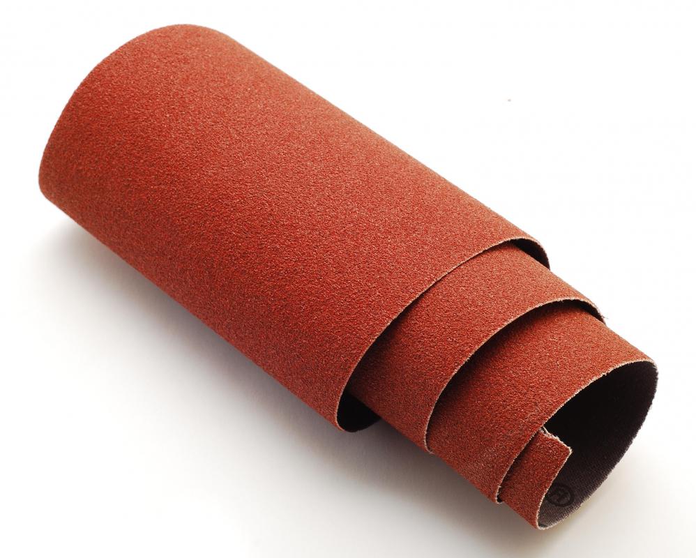 Sandpaper, which can be used to restore the nap on suede.