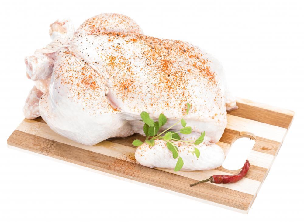 A whole chicken can be rubbed with spices and cooked in a smoker.