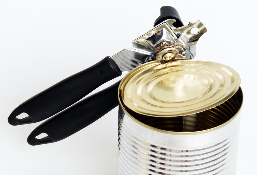 A classic can opener has a wheel for cutting around the can.