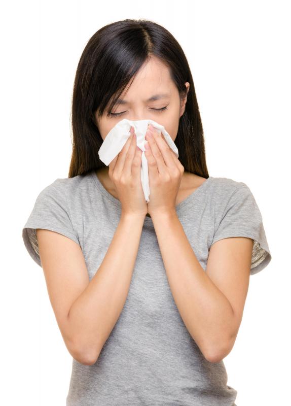 Rhinitis symptoms can include sneezing and a stuffy or runny nose.