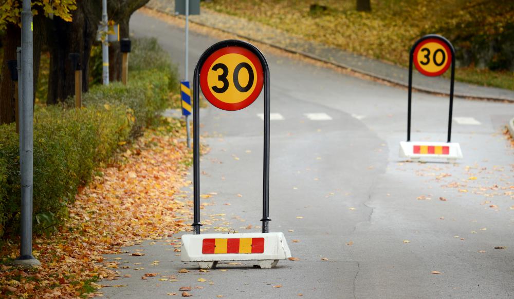 Road signs are often painted with reflective paint to enable drivers to see them at night.
