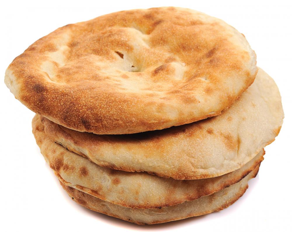 A stack of fresh pita bread.