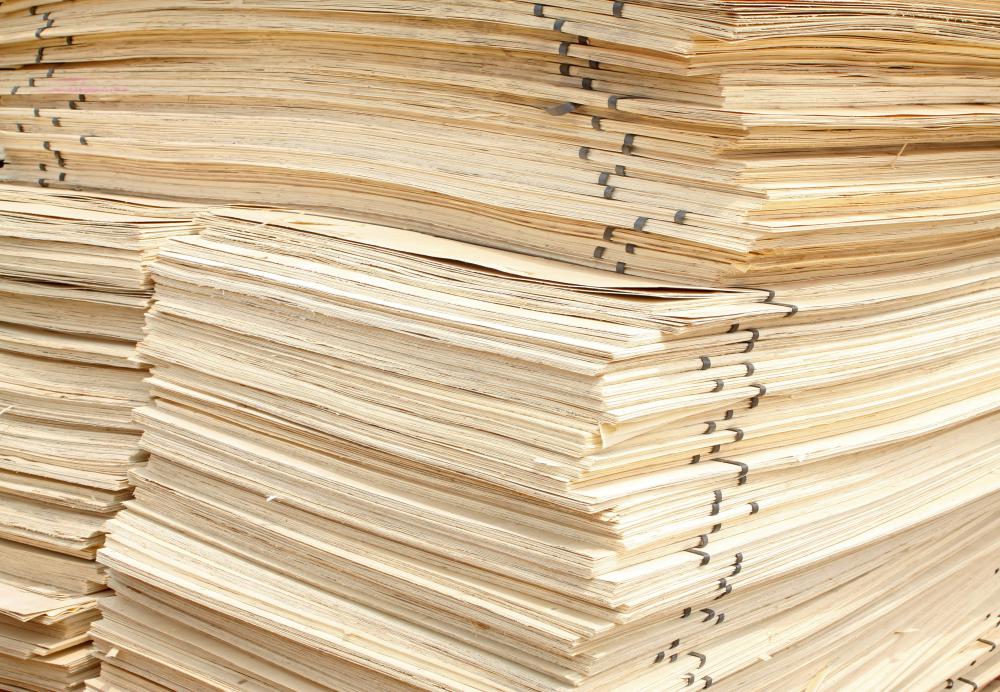 Stacks of OSB plywood sheets.