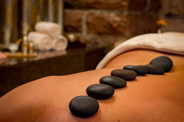 An outcall massage may involve hot stones, oils, candles, and relaxing music to add to the ambiance of the massage session.