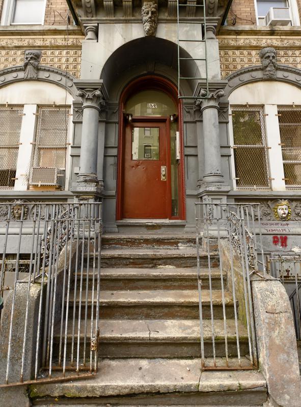 Tenements historically were single buildings divided into three or more apartments by a single landlord, often creating cramped and crowded conditions in some large cities in the 19th and early 20th centuries.
