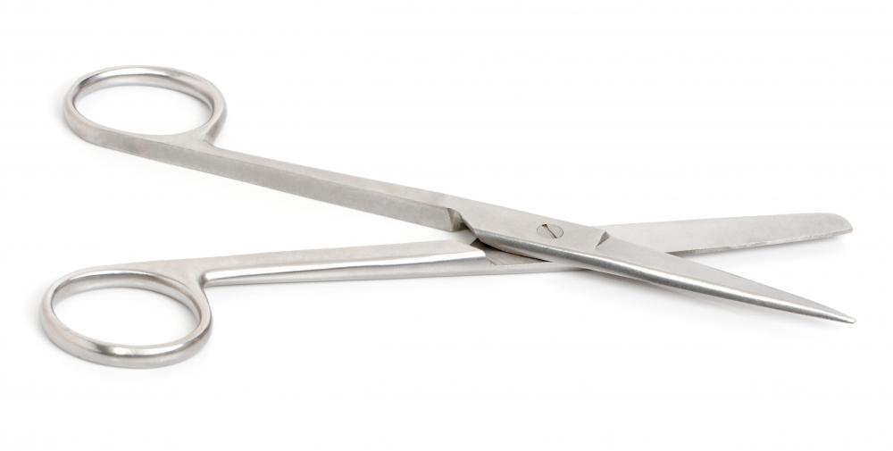 Surgical scissors may be used to remove skin tags.