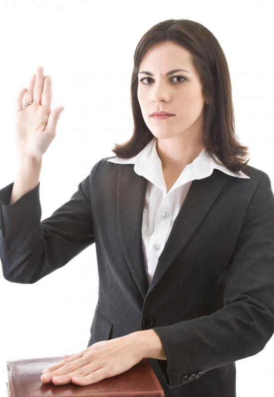 A woman taking an oath to tell the truth.