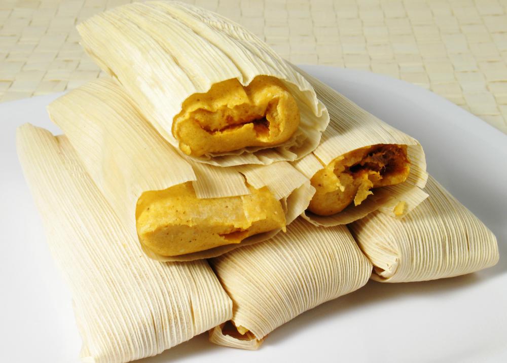 Corn husks or corn leaves are often used to wrap tamales.