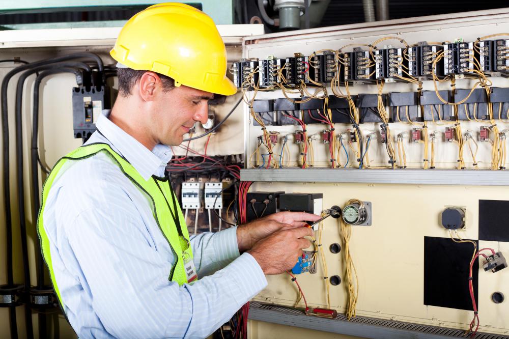 A technician repairing electrical circuits.