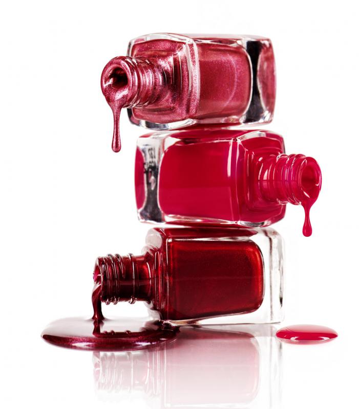 Freehand nail art is created using nail polish and a nail polish brush.