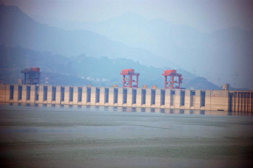 A civil engineer uses geomorphology to consider how the landscape might change before building a dam.