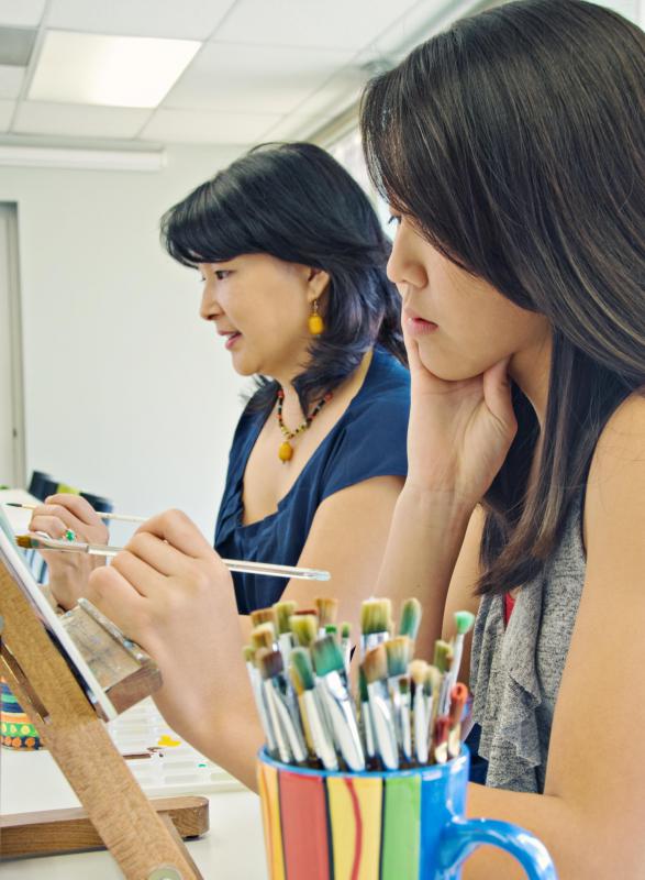 Many people enroll in art classes, learning skills such as painting.