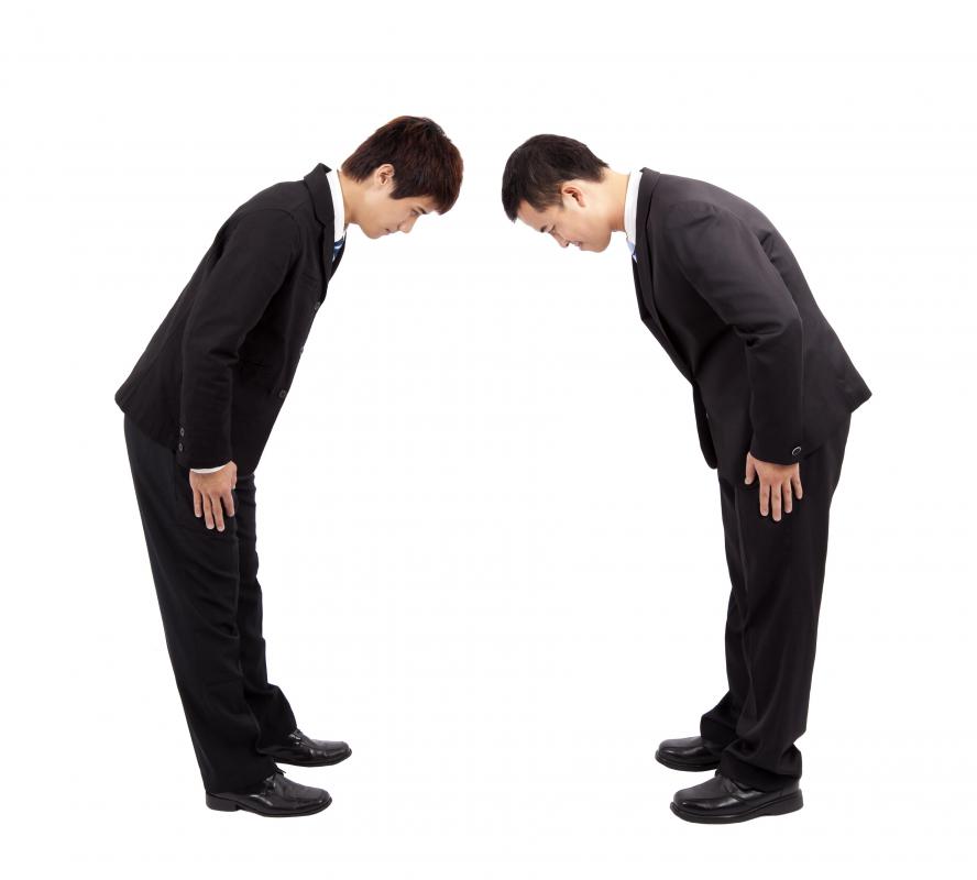 Two men bowing to each other is a part of good etiquette in some cultures.