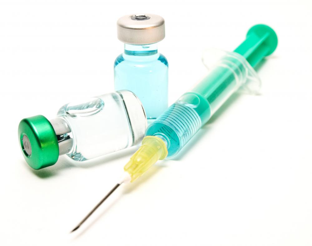 A syringe and two vials of mumps vaccine.