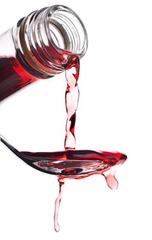 Warm vinegar may help remove glue from wooden surfaces.