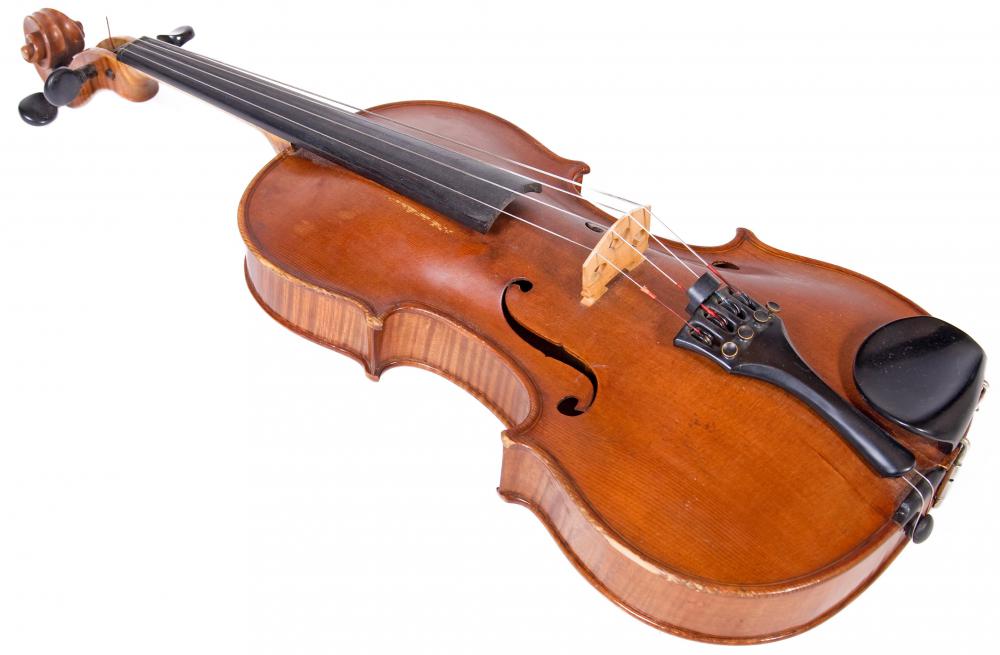 The viola is slightly larger than -- and is tuned at a lower pitch than -- the violin.