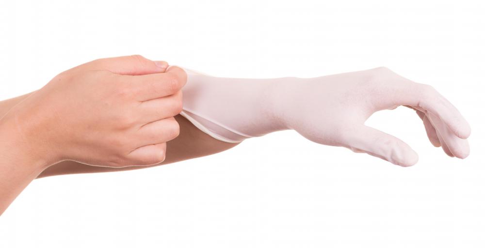 To minimize adverse reactions, patients should be advised to wear plastic or latex gloves when applying medication.