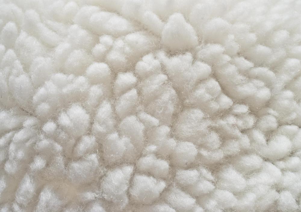 Carding wool is the process by which wool fibers are separated and prepared for spinning.