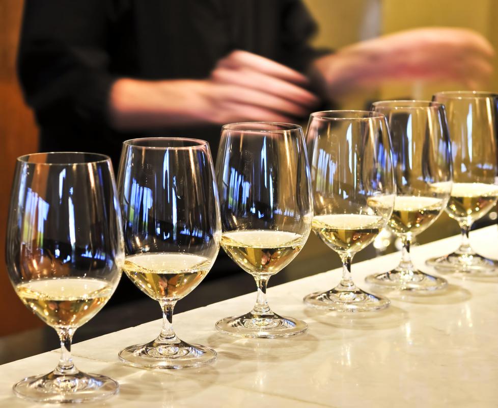 Glasses of white wine at a wine bar.