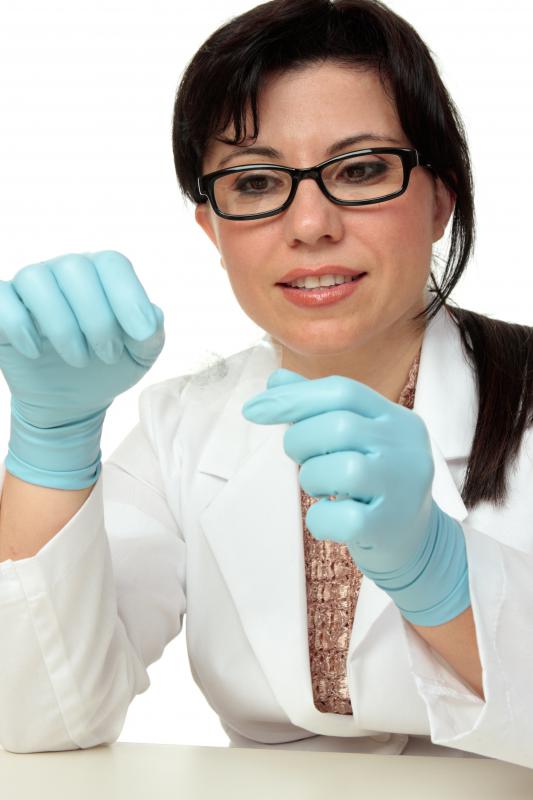 A criminologist examines evidence in the lab.