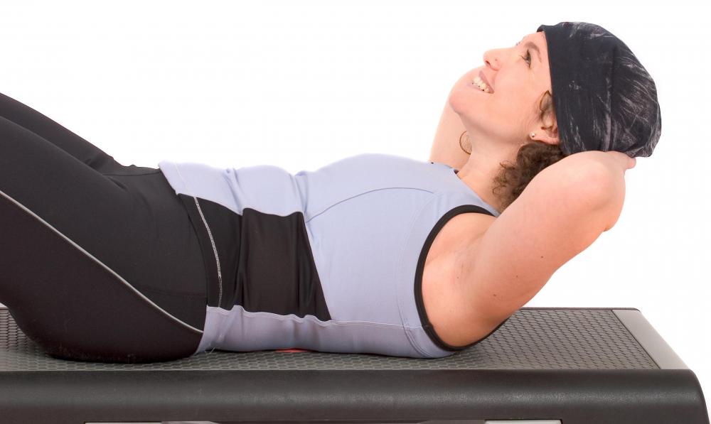 Performing an abdominal crunch involves concentric and eccentric muscle contractions, during which the muscle fibers are shortened then lengthened.