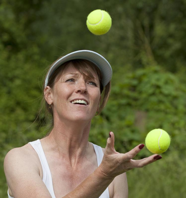 Traditional juggling involves one person tossing three or more balls in the air and catching them without them falling to the ground.