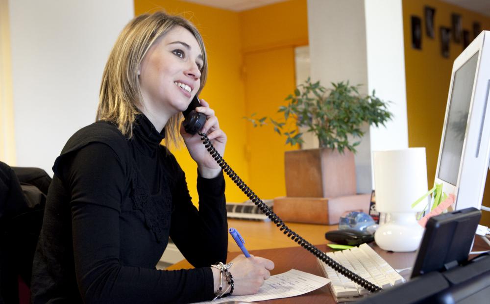 Individuals working in a shared office space environment may also share a receptionist.